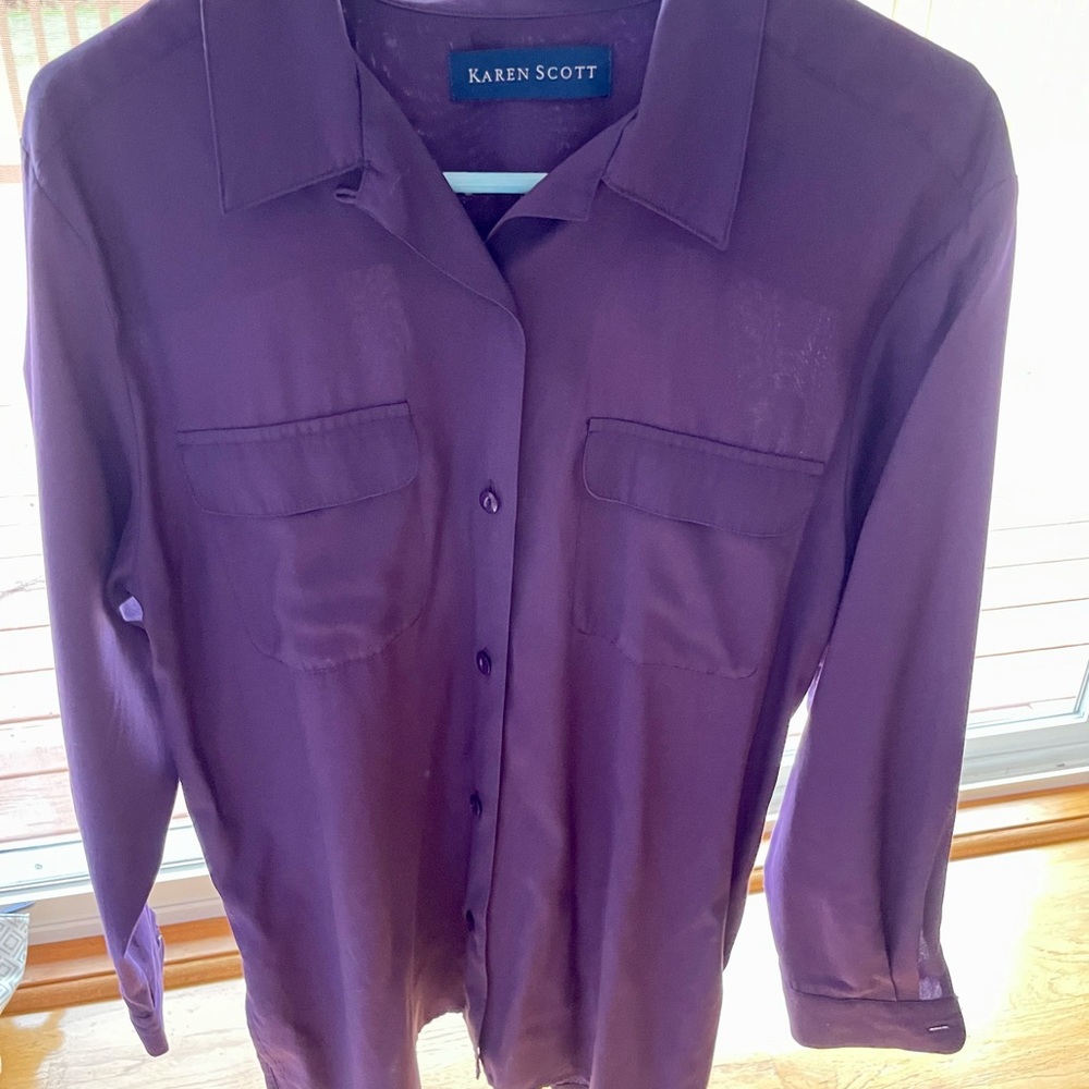 Women’s purple button down shirt.